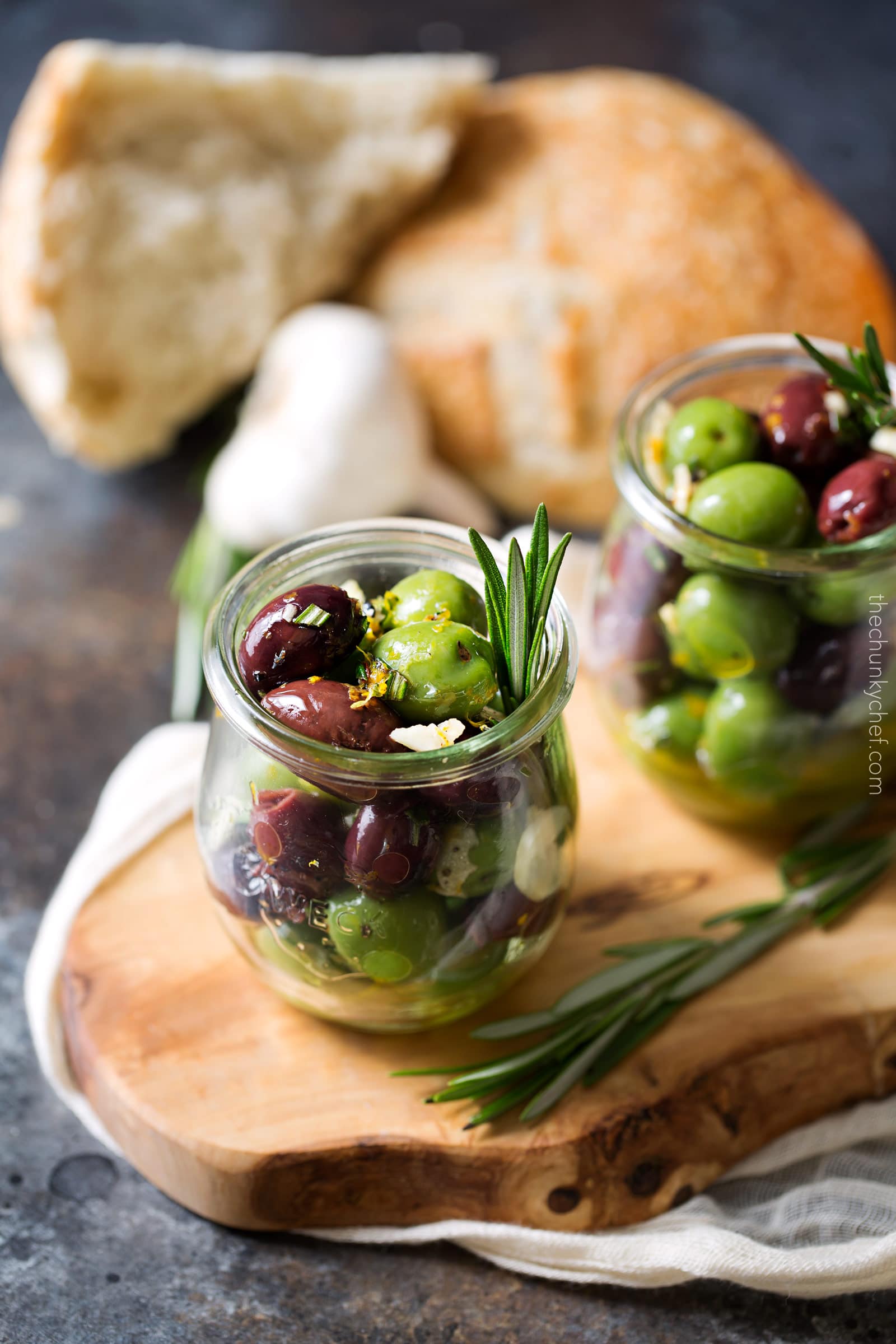 Easy Citrus Herb Marinated Olives | Kalamata and Castelvetrano olives are marinated in a mouthwatering marinade of citrus, herbs and garlic. Perfect for a snack, party, or cheese platter! | http://thechunkychef.com