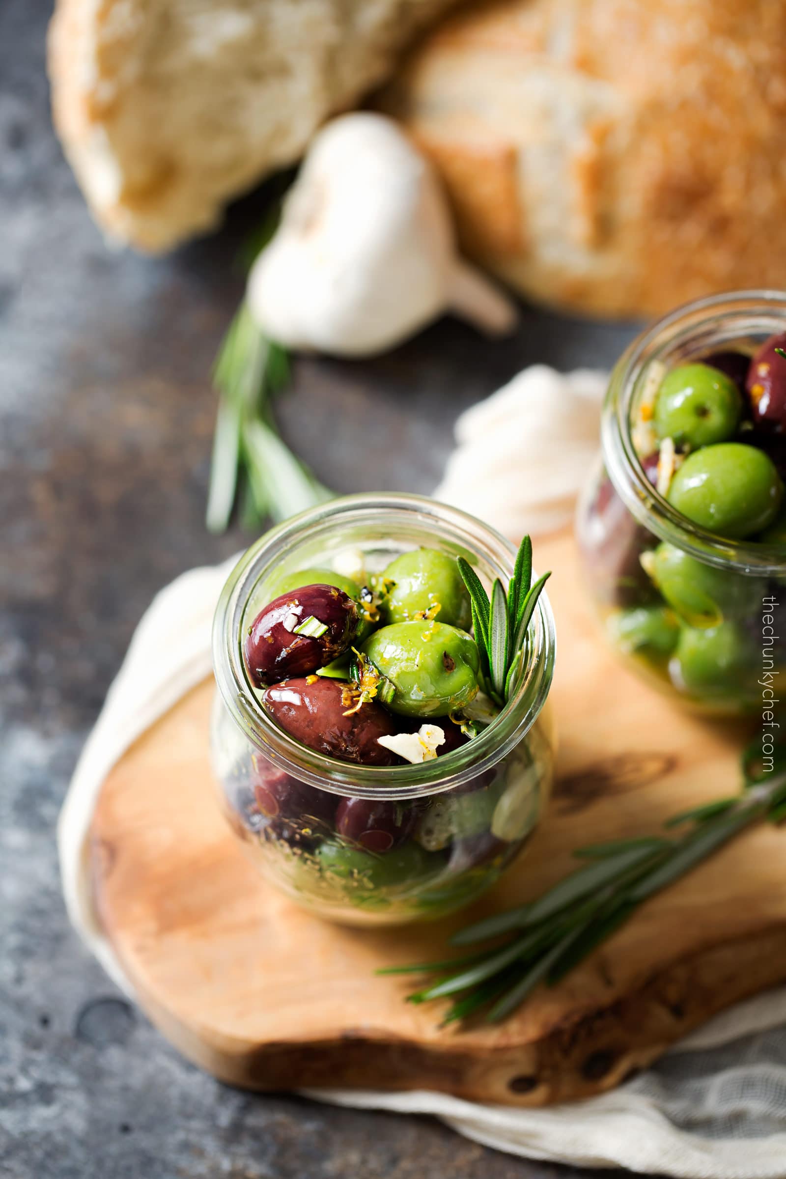 Easy Citrus Herb Marinated Olives | Kalamata and Castelvetrano olives are marinated in a mouthwatering marinade of citrus, herbs and garlic. Perfect for a snack, party, or cheese platter! | http://thechunkychef.com