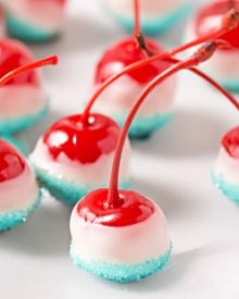 Cola Soaked Firecracker Cherries | Maraschino cherries are soaked in sweet cola, dipped in white chocolate and kissed with blue sugar for a kid-friendly patriotic dessert! | http://thechunkychef.com