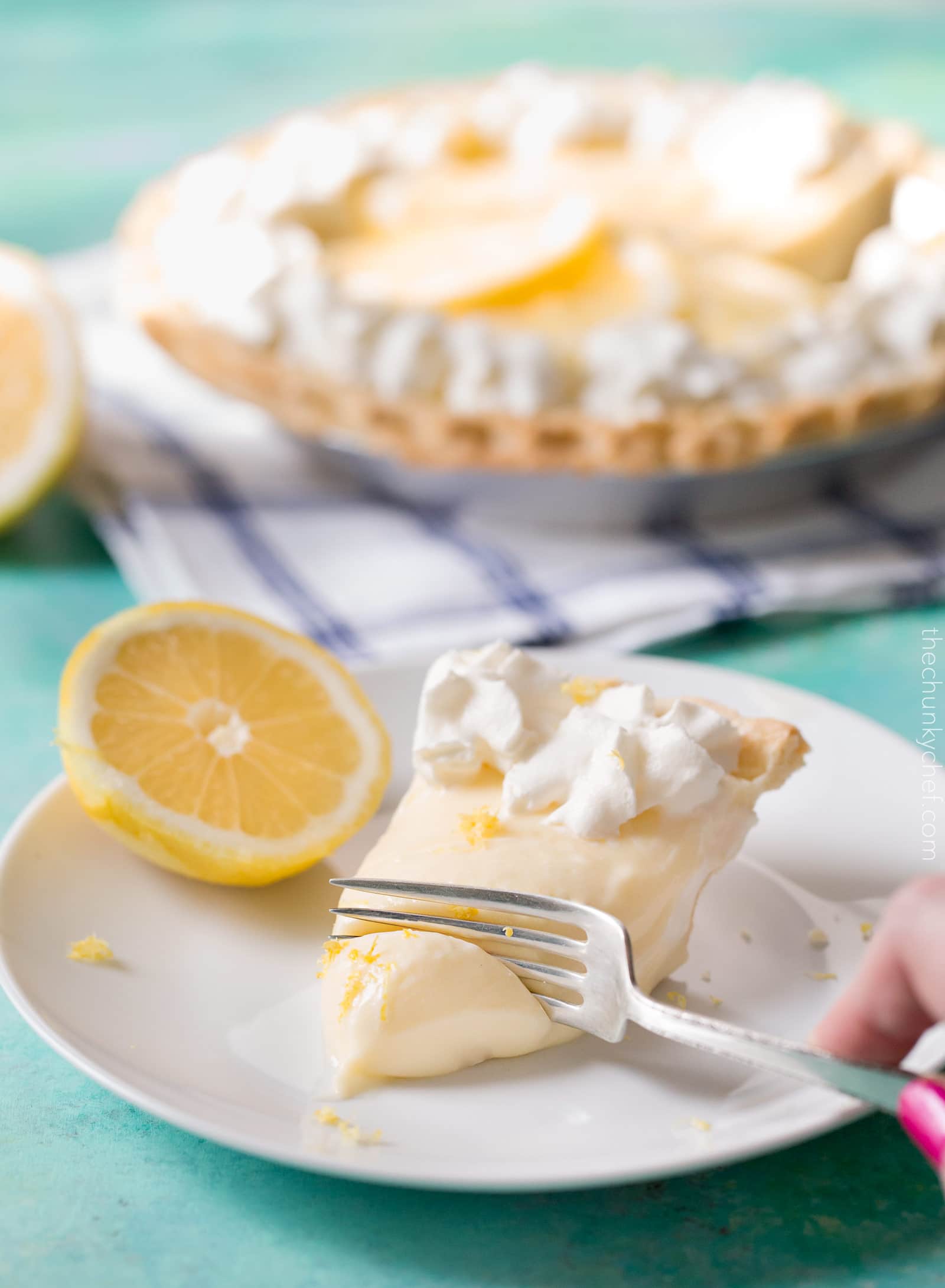 Creamy Sour Cream Lemon Pie | This almost no bake pie is cool, creamy, rich, and bursting with summer lemon flavors. The sour cream gives this dessert a delicious tang! | http://thechunkychef.com