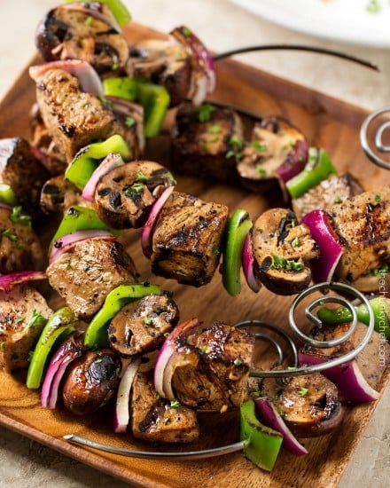 Easy Grilled Steakhouse Kebabs | Bite-sized steak pieces and mushrooms are marinated in an incredibly easy marinade, then skewered with onions and peppers, and grilled to juicy steakhouse perfection! You need these at your next BBQ! | http://thechunkychef.com