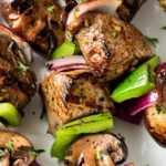 Easy Grilled Steakhouse Kebabs | Bite-sized steak pieces and mushrooms are marinated in an incredibly easy marinade, then skewered with onions and peppers, and grilled to juicy steakhouse perfection! You need these at your next BBQ! | http://thechunkychef.com