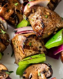 Easy Grilled Steakhouse Kebabs | Bite-sized steak pieces and mushrooms are marinated in an incredibly easy marinade, then skewered with onions and peppers, and grilled to juicy steakhouse perfection! You need these at your next BBQ! | http://thechunkychef.com
