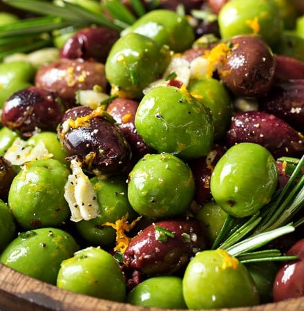 Easy Citrus Herb Marinated Olives | Kalamata and Casteltravano olives are marinated in a mouthwatering marinade of citrus, herbs and garlic. Perfect for a snack, party, or cheese platter! | http://thechunkychef.com