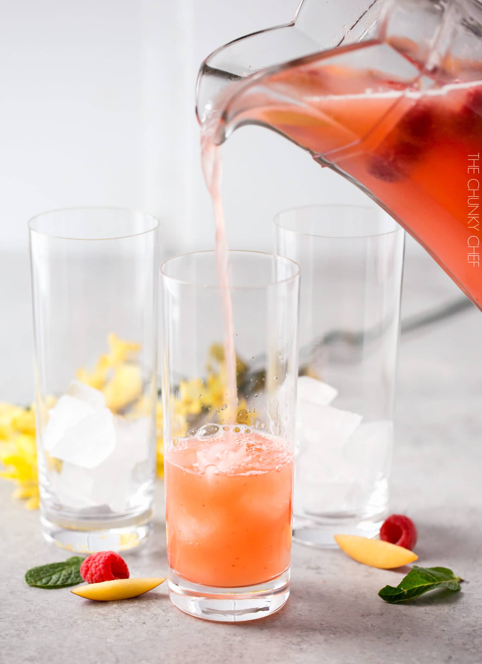 Homemade Raspberry Peach Lemonade | The perfect refreshing summer drink is here! Full of raspberry and peach flavors, this homemade lemonade is like drinking sunshine! | http://thechunkychef.com