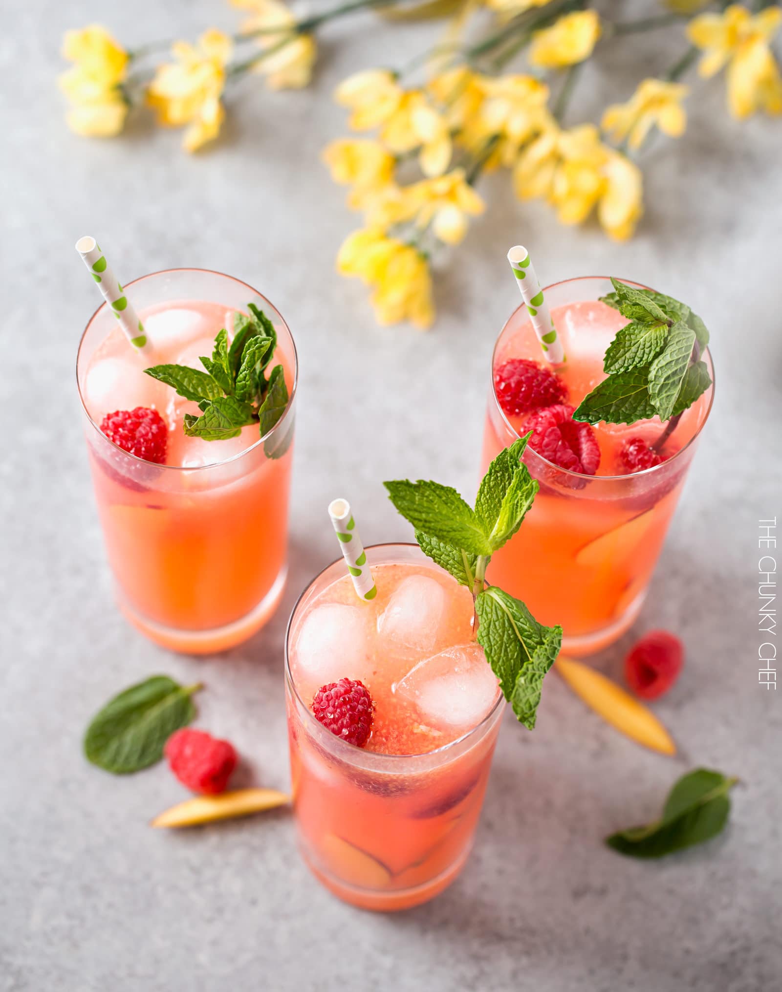 Homemade Raspberry Peach Lemonade | The perfect refreshing summer drink is here! Full of raspberry and peach flavors, this homemade lemonade is like drinking sunshine! | http://thechunkychef.com