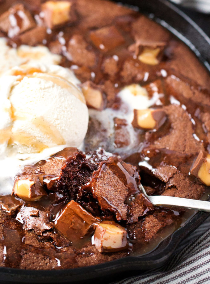 Spoon digging into a skillet brownie