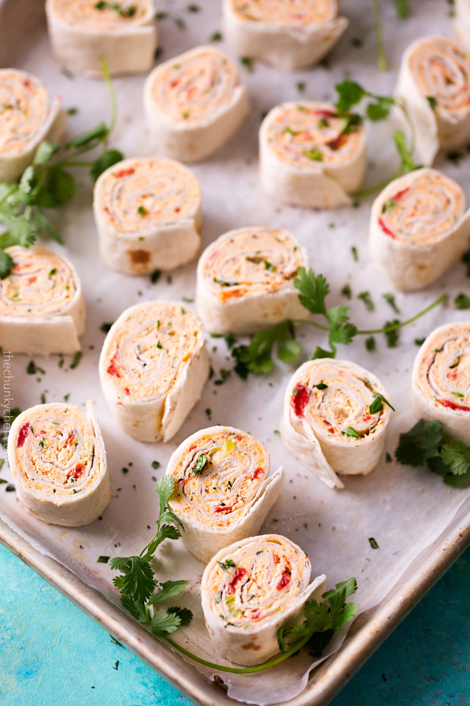 Chicken Taco Mexican Pinwheels | These pinwheels are filled with a creamy chicken taco filling, which is easily customizable, and rolled up to make a perfect appetizer or party food! | http://thechunkychef.com