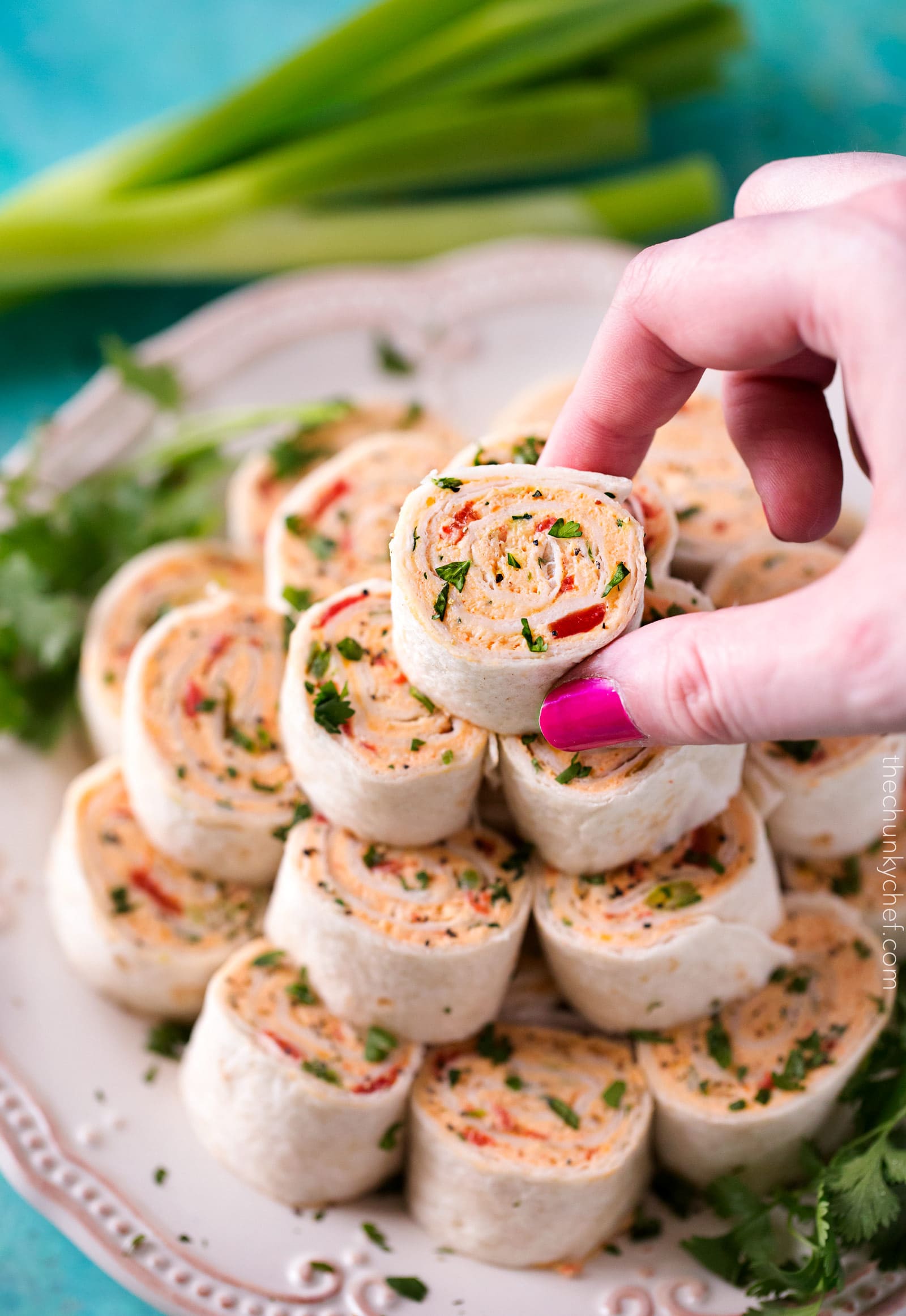 Chicken Taco Mexican Pinwheels | These pinwheels are filled with a creamy chicken taco filling, which is easily customizable, and rolled up to make a perfect appetizer or party food! | http://thechunkychef.com
