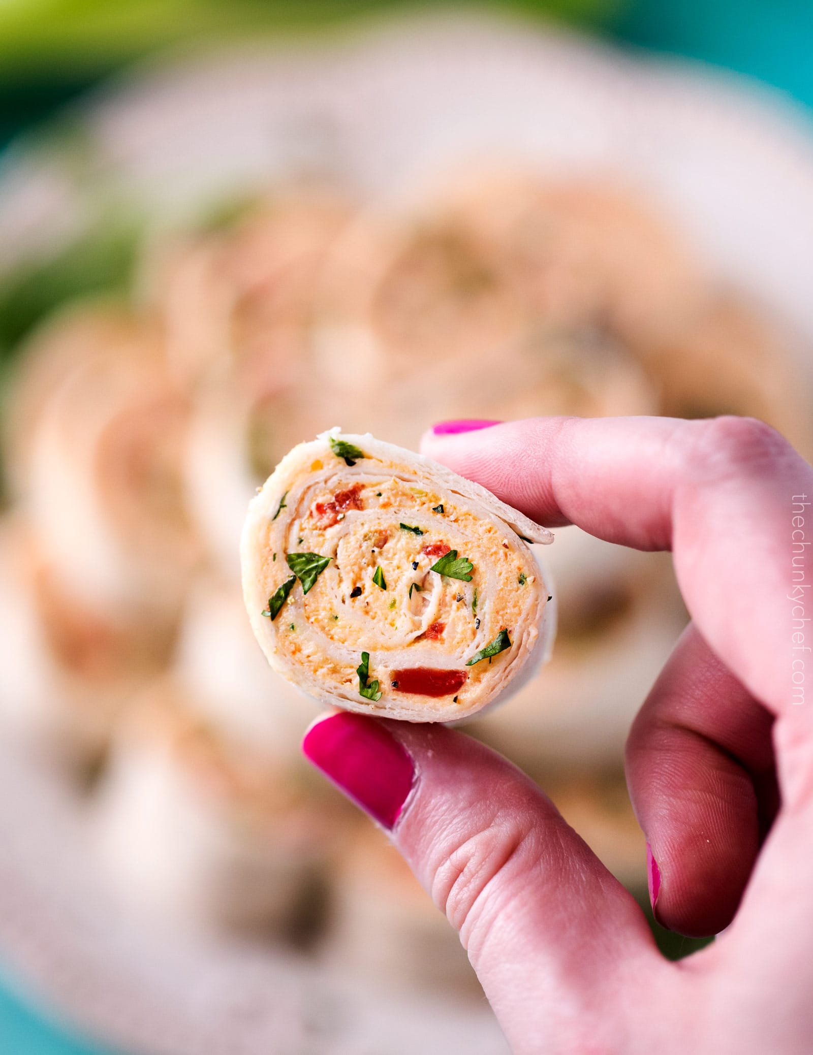 Chicken Taco Mexican Pinwheels | These pinwheels are filled with a creamy chicken taco filling, which is easily customizable, and rolled up to make a perfect appetizer or party food! | http://thechunkychef.com