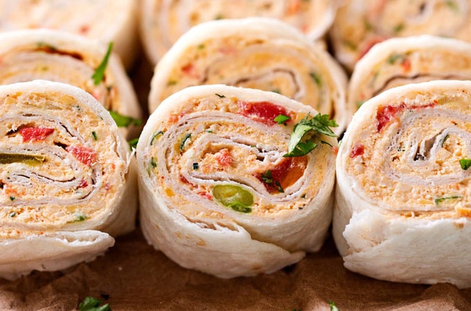 Chicken Taco Mexican Pinwheels | These pinwheels are filled with a creamy chicken taco filling, which is easily customizable, and rolled up to make a perfect appetizer or party food! | http://thechunkychef.com