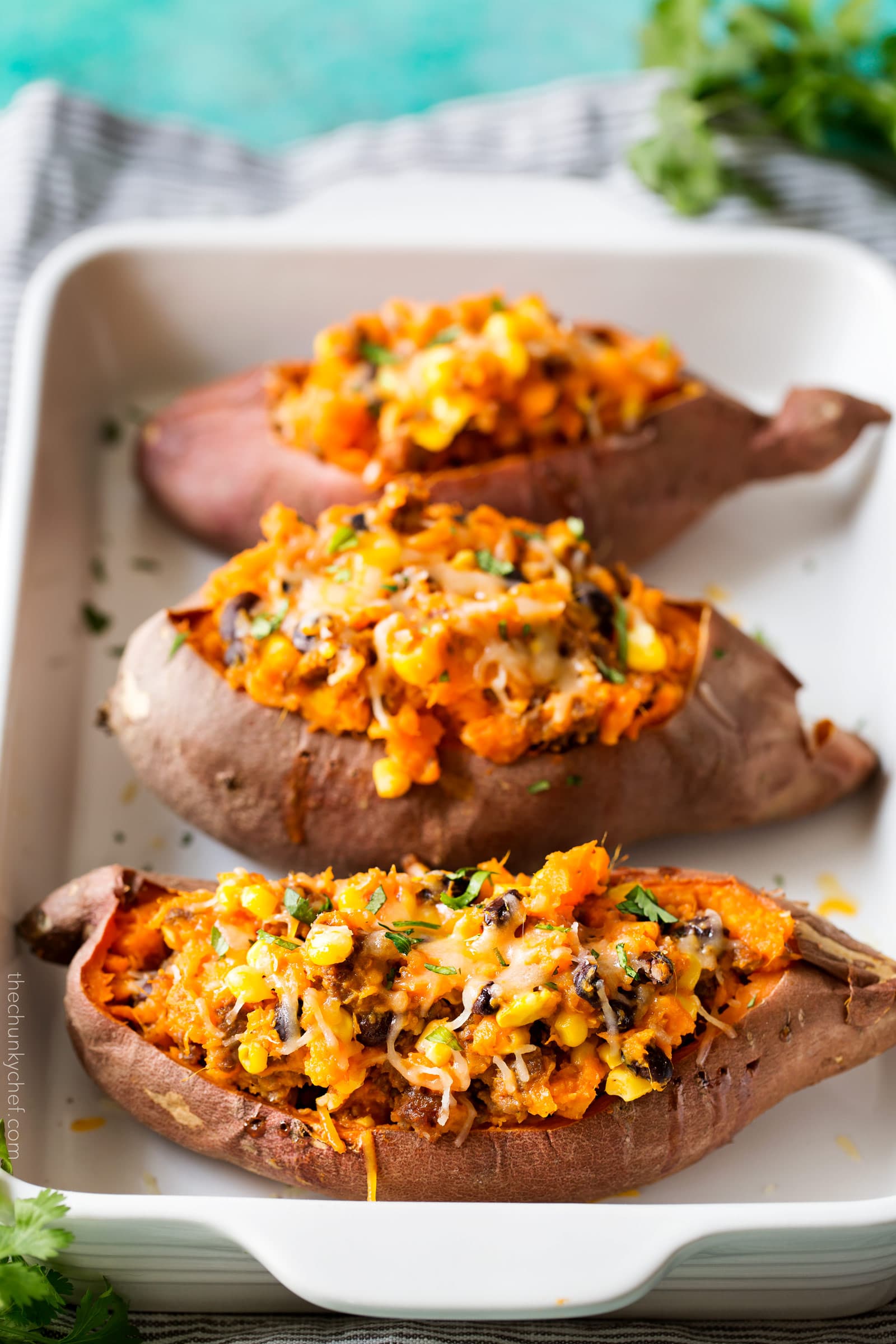 Chorizo Enchilada Stuffed Sweet Potatoes | Mexican flavors come together in these stuffed sweet potatoes, for a meal that's healthy and incredibly easy to prep ahead for a stress-free dinner! | http://thechunkychef.com