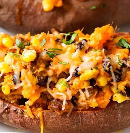 Chorizo Enchilada Stuffed Sweet Potatoes | Mexican flavors come together in these stuffed sweet potatoes, for a meal that's healthy and incredibly easy to prep ahead for a stress-free dinner! | http://thechunkychef.com