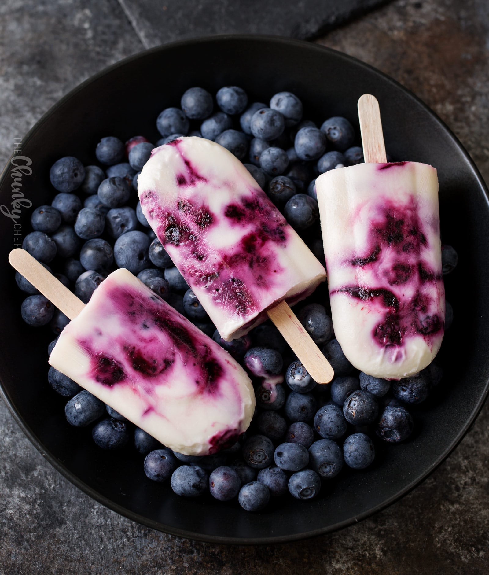 Frozen Blueberry and Lavender Yogurt Pops | An easy homemade yogurt pop made with lavender infused honey, fresh blueberries and creamy yogurt... you'll love this easy frozen dessert! | http://thechunkychef.com