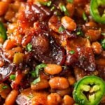 Spicy Baked Beans with Bacon | Perfect for cookouts or summer BBQ's, these baked beans with bacon have a mouthwatering spicy kick from jalapeños that make for an unforgettable side dish! | http://thechunkychef.com