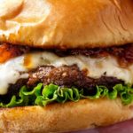 Cheeseburgers with Bourbon Bacon Jam | The only thing better than a juicy cheeseburger on a toasted bun, is a juicy cheeseburger topped with homemade bourbon bacon jam! Regular condiments are a thing of the past! | http://thechunkychef.com