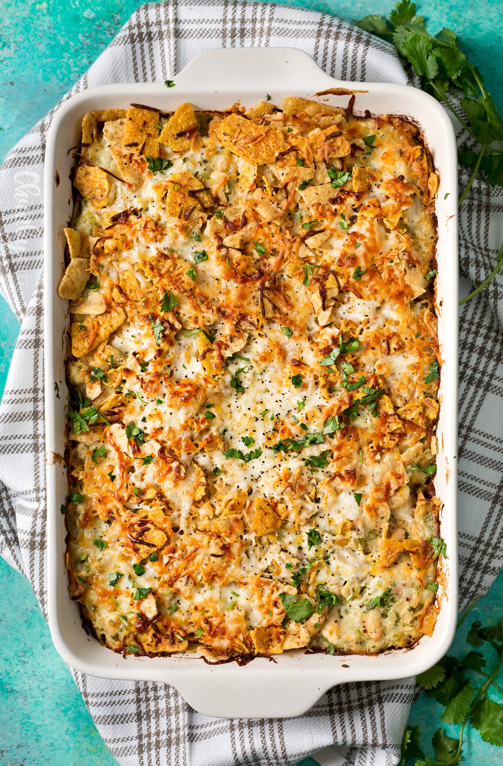 Cheesy Chicken Tortilla Casserole | A rotisserie chicken, creamy salsa verde sauce, plenty of gooey cheese and crunchy tortilla chips... it's the perfect casserole that's easy to prep ahead for a weeknight dinner! | http://thechunkychef.com