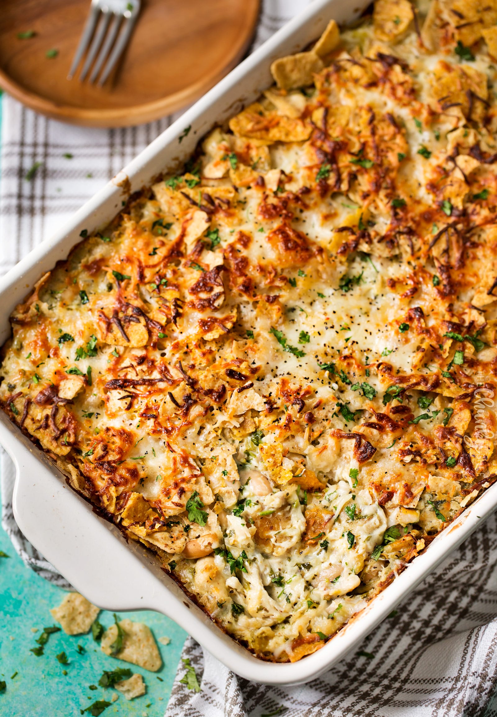 Cheesy Chicken Tortilla Casserole | A rotisserie chicken, creamy salsa verde sauce, plenty of gooey cheese and crunchy tortilla chips... it's the perfect casserole that's easy to prep ahead for a weeknight dinner! | http://thechunkychef.com