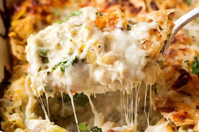 Cheesy Chicken Tortilla Casserole | A rotisserie chicken, creamy salsa verde sauce, plenty of gooey cheese and crunchy tortilla chips... it's the perfect casserole that's easy to prep ahead for a weeknight dinner! | http://thechunkychef.com