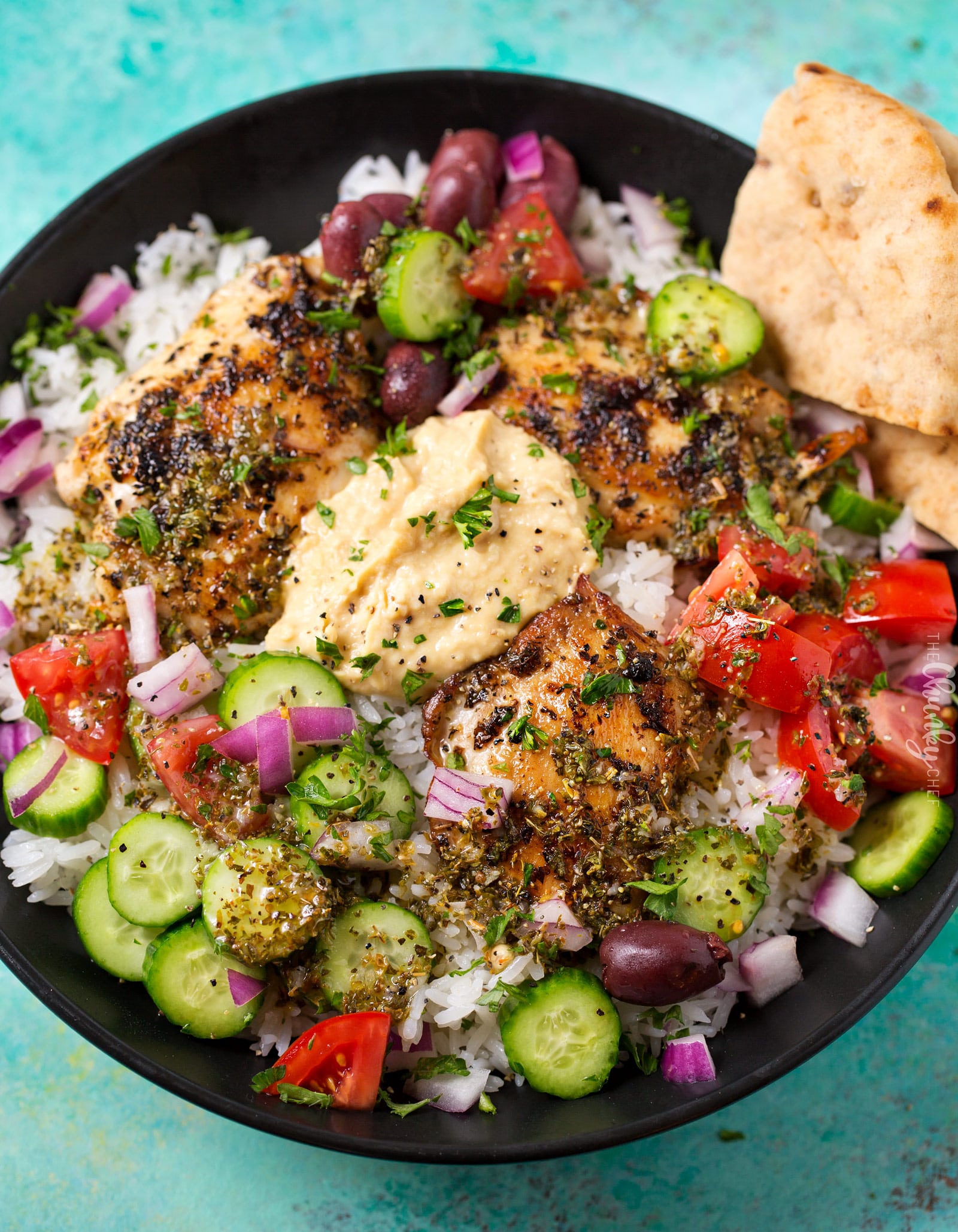 Hearty Greek Chicken and Rice Bowl | Ready in just 20 minutes or less, this rice bowl is packed with great Greek and Mediterranean flavors!  It's also perfect for meal prep or a back to school lunch box idea! | http://thechunkychef.com