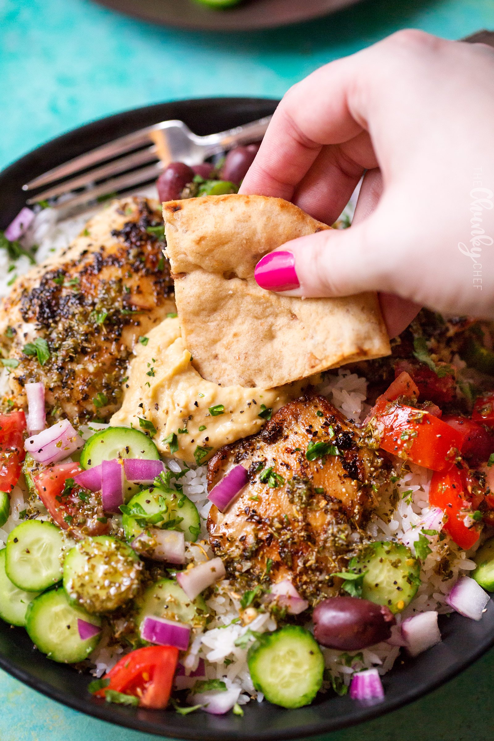 Hearty Greek Chicken and Rice Bowl | Ready in just 20 minutes or less, this rice bowl is packed with great Greek and Mediterranean flavors!  It's also perfect for meal prep or a back to school lunch box idea! | http://thechunkychef.com