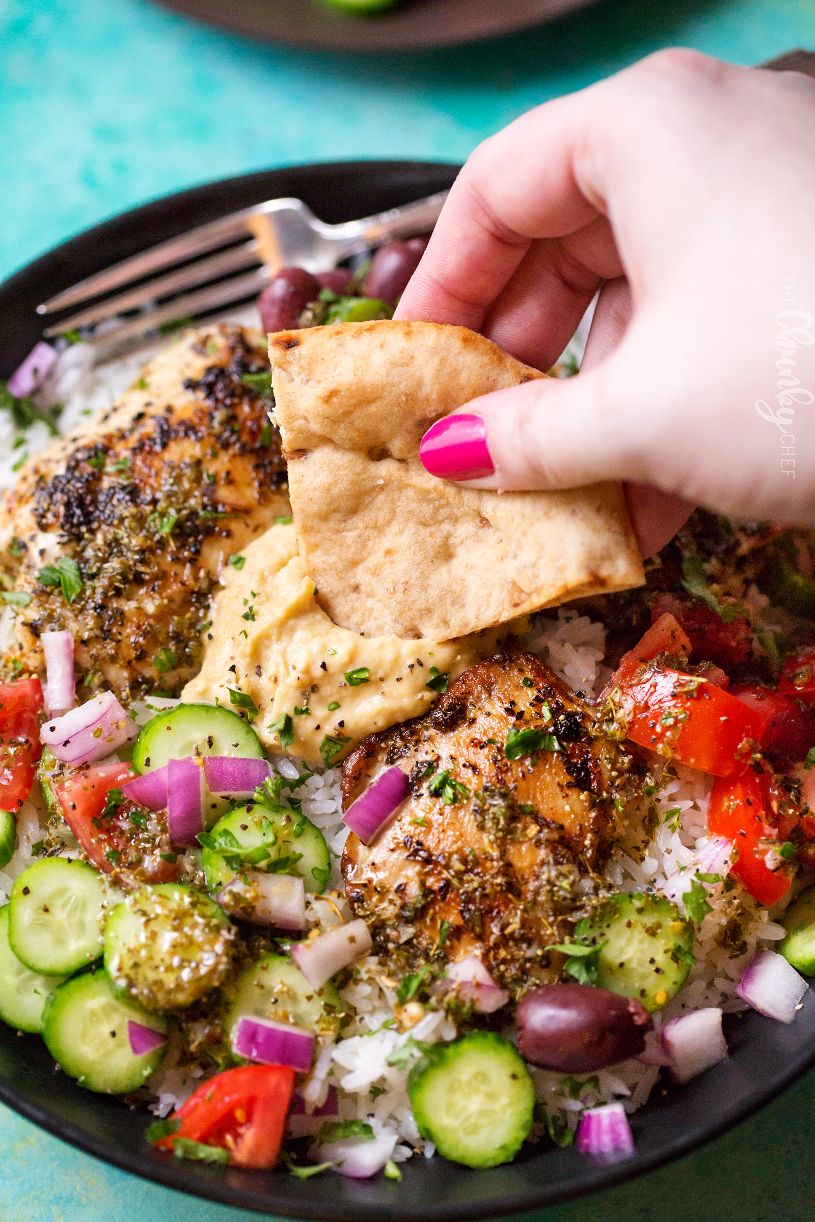 Hearty Greek Chicken and Rice Bowl | Ready in just 20 minutes or less, this rice bowl is packed with great Greek and Mediterranean flavors!  It's also perfect for meal prep or a back to school lunch box idea! | http://thechunkychef.com