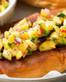 Grilled Bratwurst with Spicy Peach Salsa | No more boring brat toppings here... serve up your traditional grilled beer brats with this habanero peach salsa and prepare to be amazed! Plus, tips for how to serve these brats when grilling isn't an option. | http://thechunkychef.com