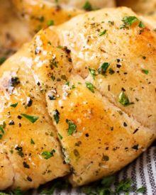 Cheesy Garlic Crescent Rolls | Soft, buttery crescent rolls are baked with gooey mozzarella cheese, and brushed with an insanely flavorful garlic and herb butter! Ready in less than 20 minutes! | http://thechunkychef.com