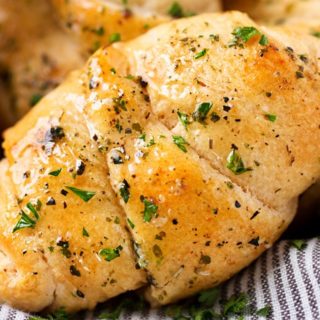 Cheesy Garlic Crescent Rolls | Soft, buttery crescent rolls are baked with gooey mozzarella cheese, and brushed with an insanely flavorful garlic and herb butter! Ready in less than 20 minutes! | http://thechunkychef.com