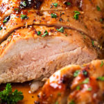 Ginger Honey Roasted Pork Tenderloin | Perfect for a busy weeknight, this pork tenderloin is loaded with amazing flavors and ready in less than 30 minutes! | https://thechunkychef.com | #dinner #pork #roasted #easyrecipe