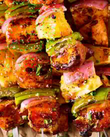 Grilled BBQ Chicken Kabobs | These chicken kabobs are loaded with flavor, from the homemade spice rub, to the perfect bbq sauce they're basted with. Plus, tips for how to skewer bacon, and how to cook these kabobs when grilling isn't an option. | http://thechunkychef.com | chicken | kabob| kebab | skewer | bbq | easy | grilled | summer