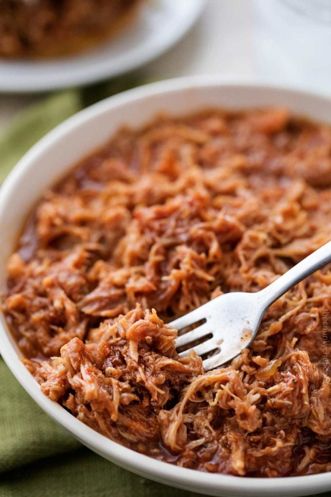 The most incredibly tender pulled pork, made easily in an hour in the Instant Pot!  With just 4 ingredients, it's perfect to throw together for dinner with minimal effort! 