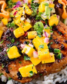 Jerk Chicken Thighs with Avocado Mango Salsa | Perfect for a busy weeknight, this chicken recipe comes together quickly and tastes amazing! The avocado mango salsa is nutritious and phenomenal on the chicken, or with chips! | https://thechunkychef.com