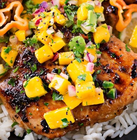Jerk Chicken Thighs with Avocado Mango Salsa | Perfect for a busy weeknight, this chicken recipe comes together quickly and tastes amazing!  The avocado mango salsa is nutritious and phenomenal on the chicken, or with chips! | https://thechunkychef.com