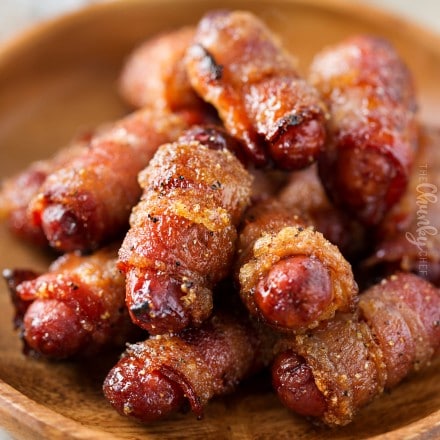 Plate of bacon wrapped little smokies (cocktail sausages)