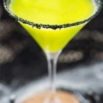 Witches Brew Halloween Cocktail | Sweet and mysterious, this Halloween cocktail practically glows with an eerie greenish color! Made with just 3 simple ingredients, it's a must make for any party! | https://www.the5oclockchef.com | #cocktail #halloween #witch #partydrink #midori