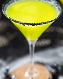 Witches Brew Halloween Cocktail | Sweet and mysterious, this Halloween cocktail practically glows with an eerie greenish color! Made with just 3 simple ingredients, it's a must make for any party! | https://www.the5oclockchef.com | #cocktail #halloween #witch #partydrink #midori