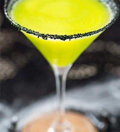 Witches Brew Halloween Cocktail | Sweet and mysterious, this Halloween cocktail practically glows with an eerie greenish color! Made with just 3 simple ingredients, it's a must make for any party! | https://www.the5oclockchef.com | #cocktail #halloween #witch #partydrink #midori