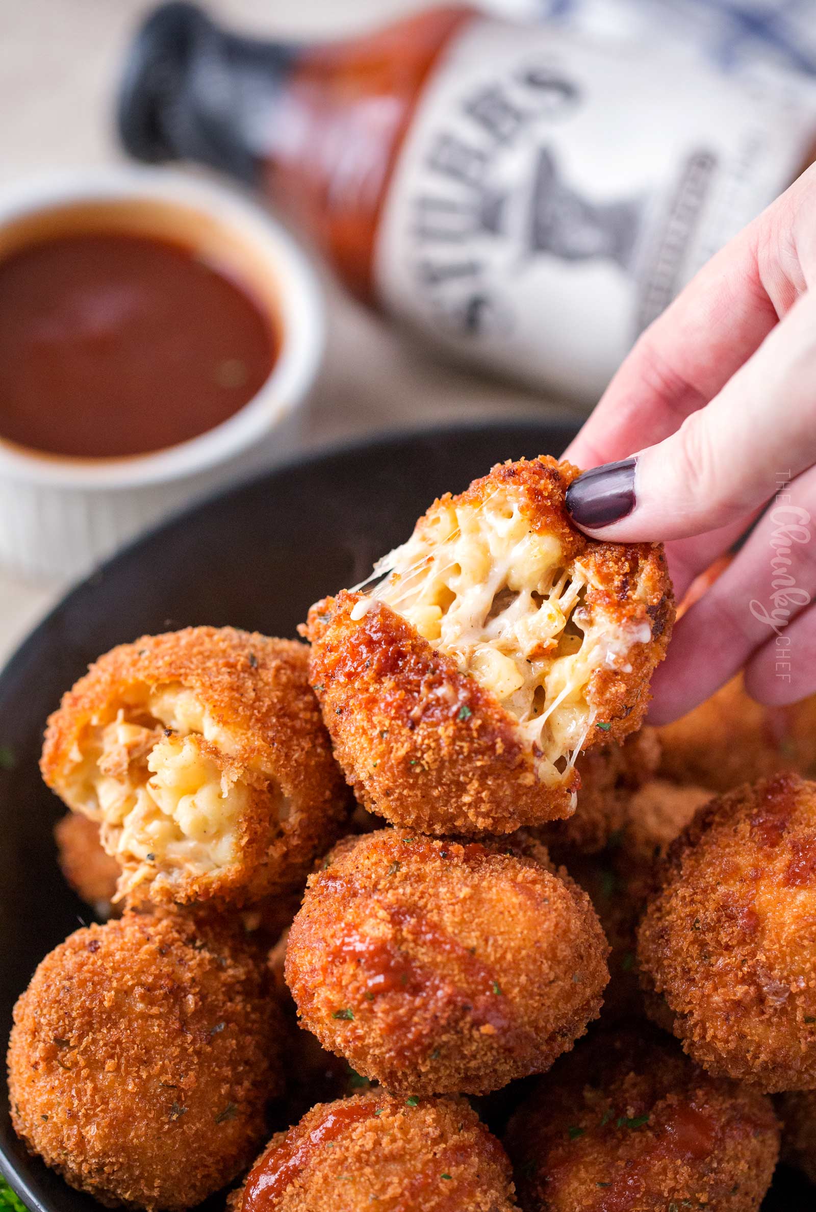 BBQ Pulled Pork Fried Mac and Cheese Bites | 5 cheese homemade Mac and cheese, slow cooker bbq pulled pork, combined and breaded in crispy spiced panko and fried until perfectly golden! | https://thechunkychef.com | #appetizer #gameday #tailgating #friedmacandcheese #pulledpork