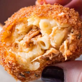 BBQ Pulled Pork Fried Mac and Cheese Bites | 5 cheese homemade Mac and cheese, slow cooker bbq pulled pork, combined and breaded in crispy spiced panko and fried until perfectly golden! | https://thechunkychef.com | #appetizer #gameday #tailgating #friedmacandcheese #pulledpork