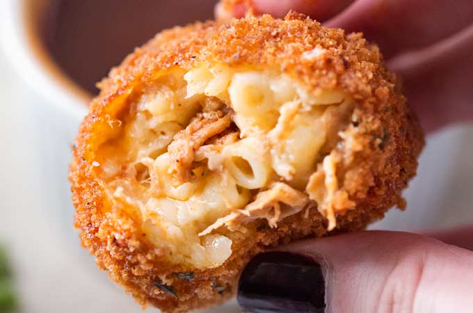 BBQ Pulled Pork Fried Mac and Cheese Bites | 5 cheese homemade Mac and cheese, slow cooker bbq pulled pork, combined and breaded in crispy spiced panko and fried until perfectly golden! | https://thechunkychef.com | #appetizer #gameday #tailgating #friedmacandcheese #pulledpork