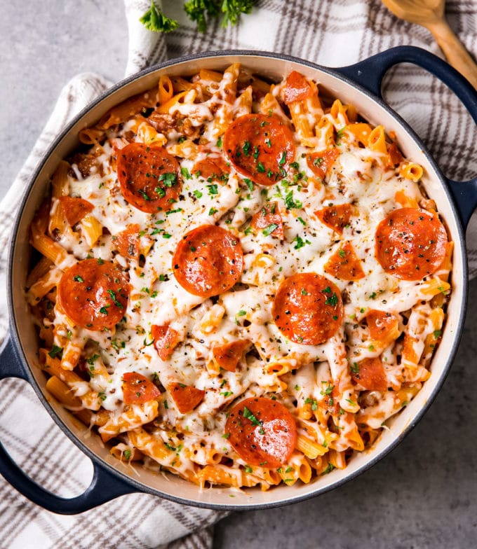 Cheesy pizza pasta in dutch oven