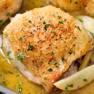 One Pan Apple Glazed Chicken Thighs | Crispy, yet juicy chicken thighs, cooked in a sweet apple and herb sauce, in one pan, and ready in just 30 minutes! It's the perfect weeknight meal! | https://www.thechunkychef.com | #chickendinner #weeknightmeal #quickmeal #30minutemeal #apples #onepan #onepot