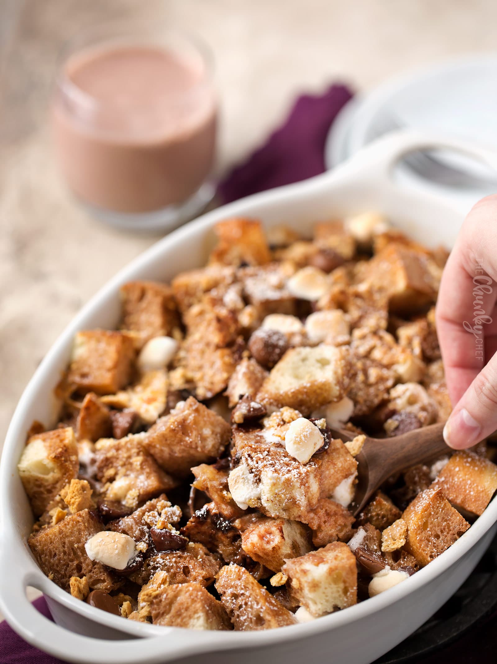 Spoon serving a scoop of French toast casserole