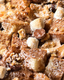 Overnight S'mores French Toast Casserole | Perfect for a holiday breakfast or brunch, sourdough bread is mixed with chocolate chips, marshmallows and graham crackers, then baked up into pure French toast perfection! | https://thechunkychef.com | #frenchtoast #breakfast #brunch #casserole