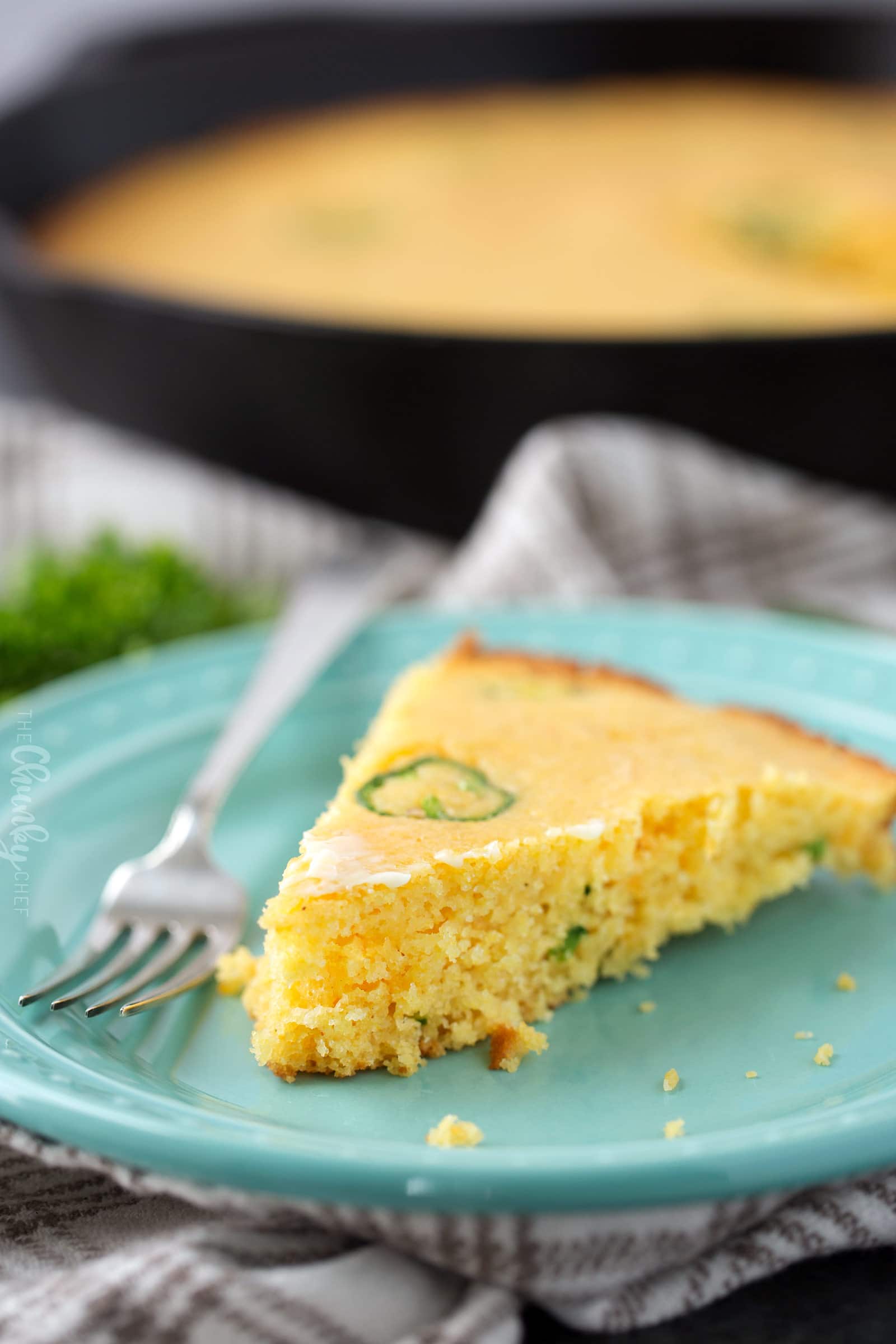 Slice of cornbread on plate with fork