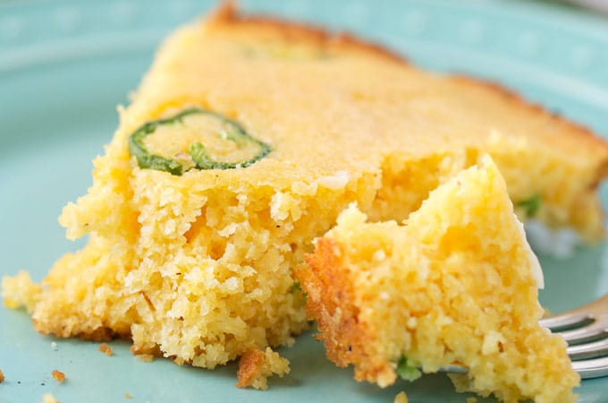 Skillet Jalapeno Cheddar Homemade Cornbread | In true homestyle fashion, this jalapeño cheddar cornbread is baked in a cast iron skillet with bacon drippings for extra flavor!  Soft inside, with a mouthwatering crunch on the outside, this cornbread is the one you've been looking for! | https://www.thechunkychef.com | #cornbread #homemade #jalapenocheddar #castiron #homestyle