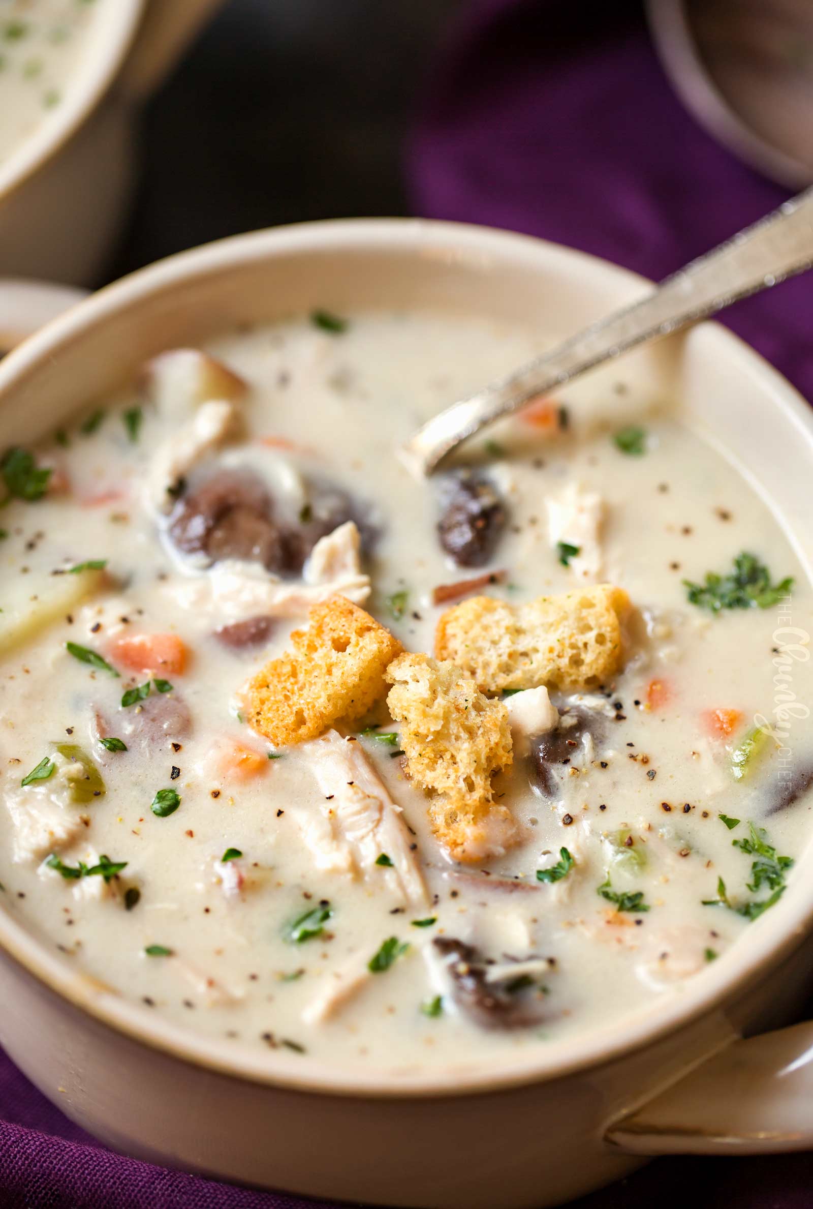 Chowder in serving bowl topped with crunchy croutons