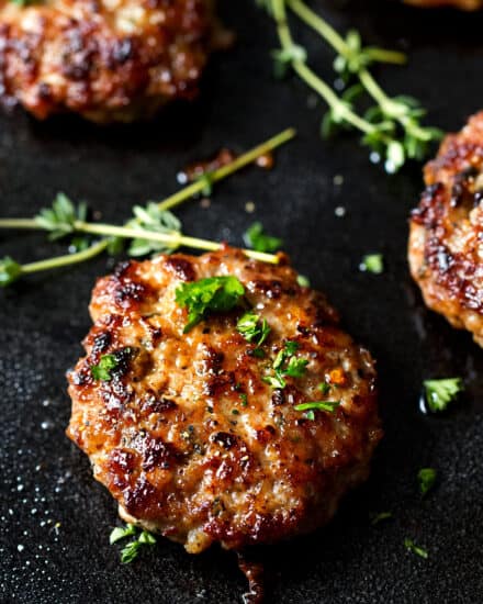 These Maple Breakfast Sausage patties are made with a combo of ground turkey and pork, savory herbs, and sweet maple syrup. Your favorite breakfast meat - perfect to make ahead and freeze! #breakfast #sausage #maple #turkey #pork #patties #makeahead #freeze