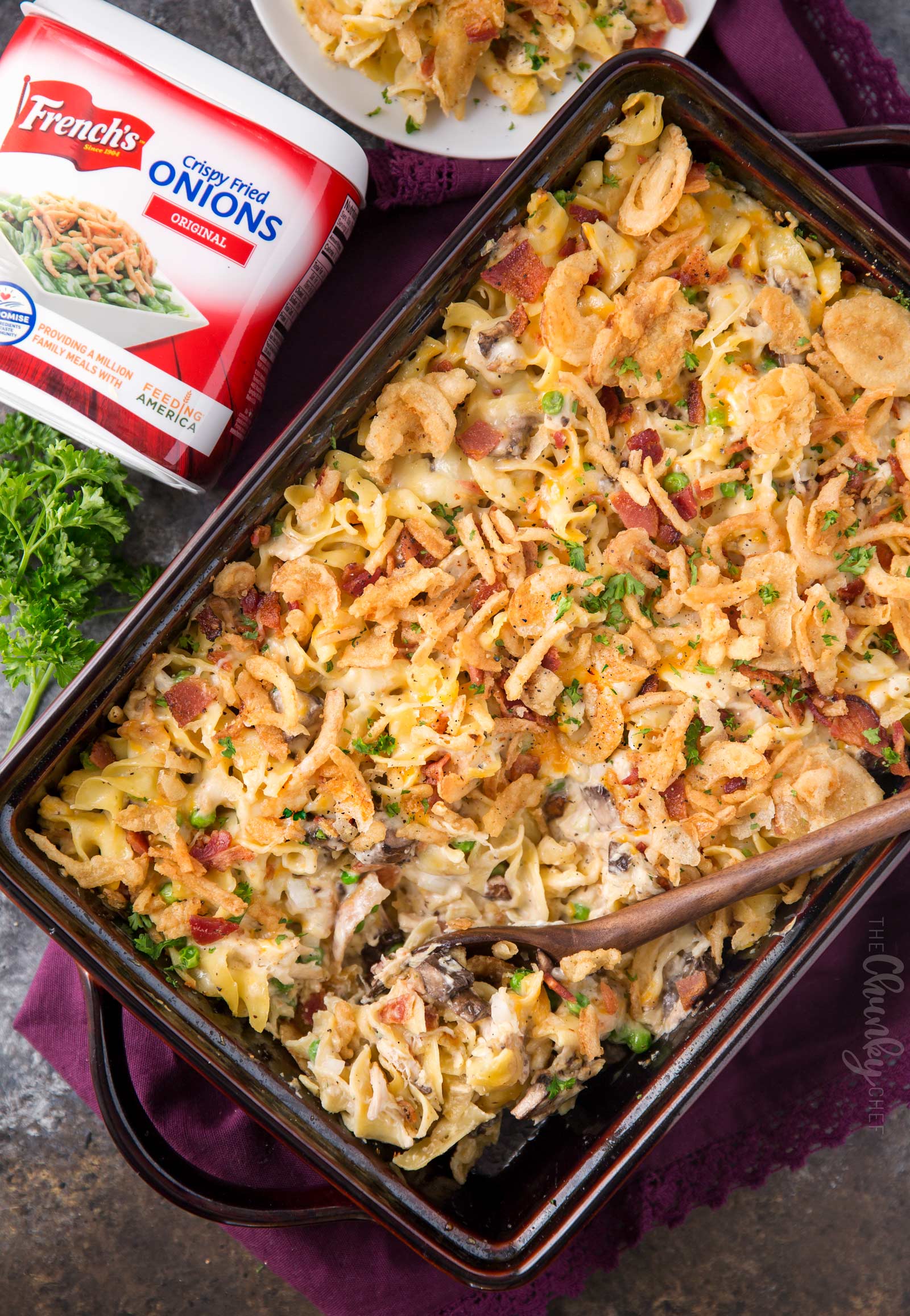 Loaded Cheesy Chicken Noodle Casserole | This chicken noodle casserole has great classic chicken noodle flavors, with some added flavors like bacon, mushrooms, and a crunchy fried onion topping!  Great for a make-ahead meal, this casserole will be family favorite! | The Chunky Chef | #chickennoodle #chickencasserole #casserole #makeahead #comfortfoods #weeknightmeals